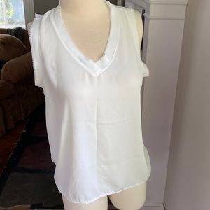 White sleeveless blouse